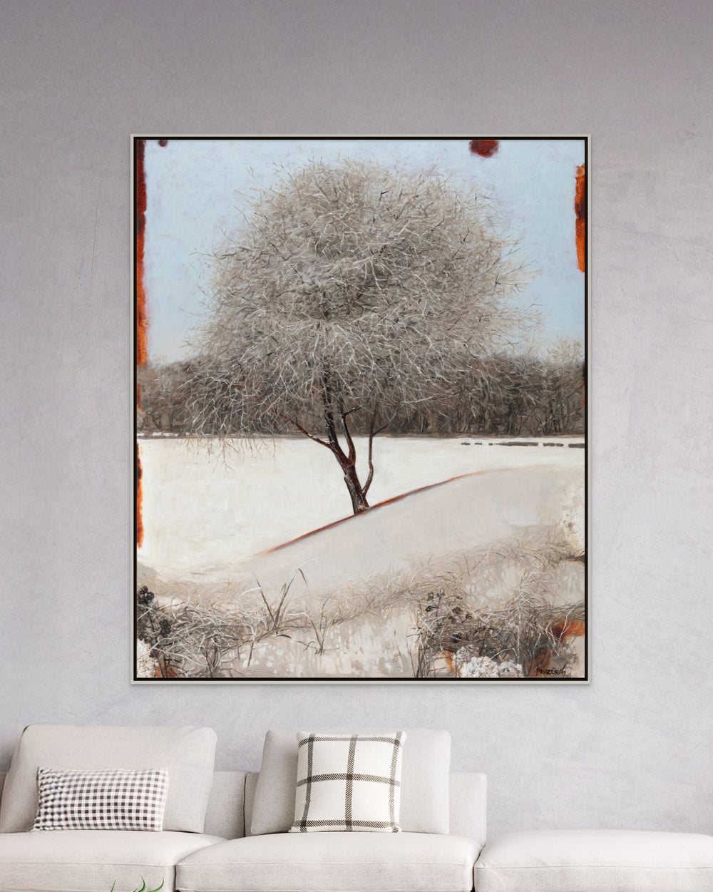 Framed canvas artwork featuring a single bare tree and snow-covered hills