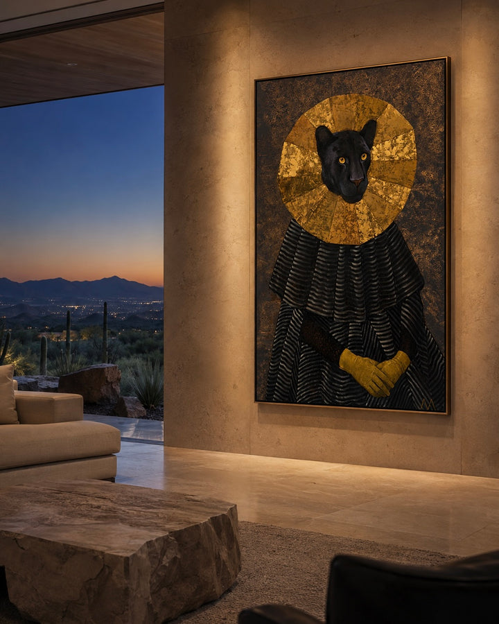 A large framed wall art piece hangs in a modern living room. The artwork depicts a black panther with a gold circular halo and black-and-gold robe against a dark textured background.