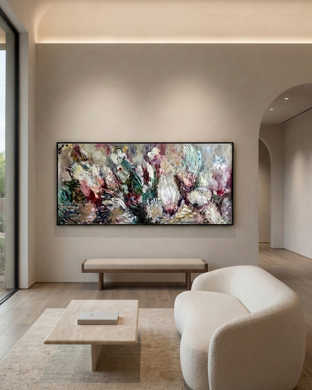 Modern living room with a large abstract painting on the wall, a white sofa, and a coffee table.