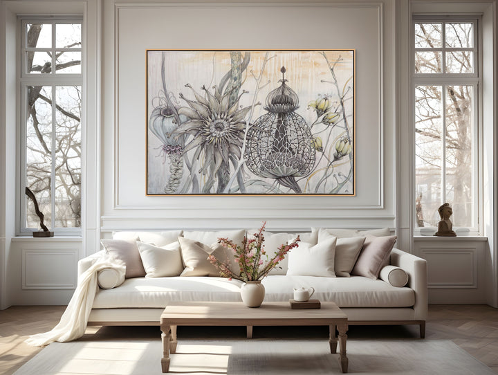 Living room with a sofa, coffee table, and decorative wall art.