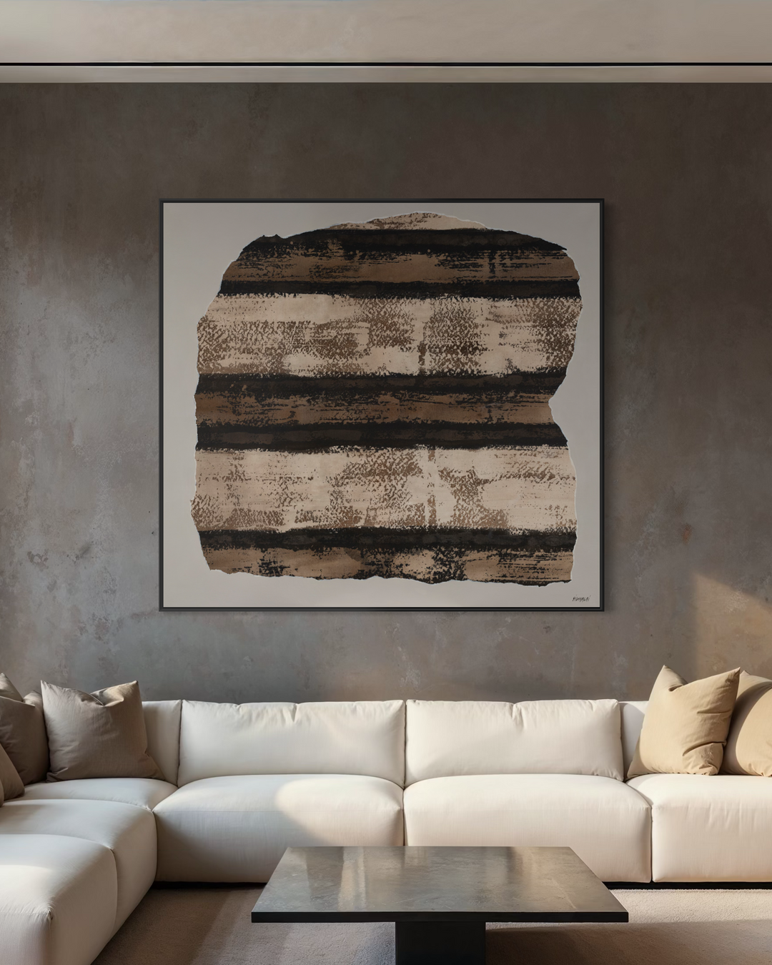 Modern living room with a white sectional sofa, coffee table, and abstract wall art.