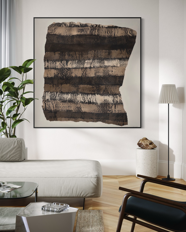 Modern living room with abstract art on the wall, sofa, and coffee table.