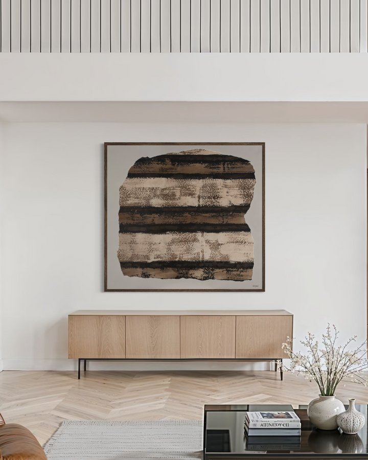 Modern living room with a gray sofa, brown armchair, and coffee table.