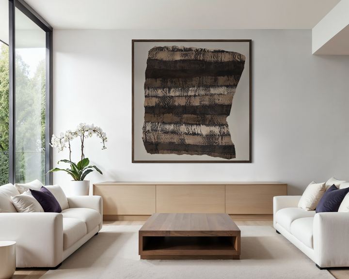 Modern living room with white sofas, a wooden coffee table, and abstract art on the wall.