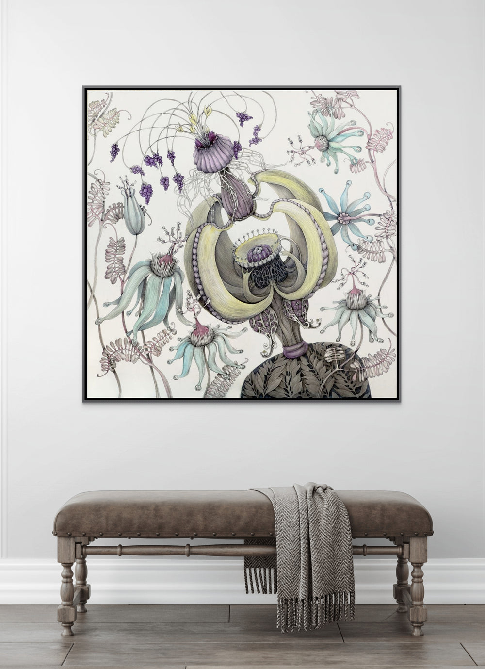 Framed botanical art piece on a wall above a bench.
