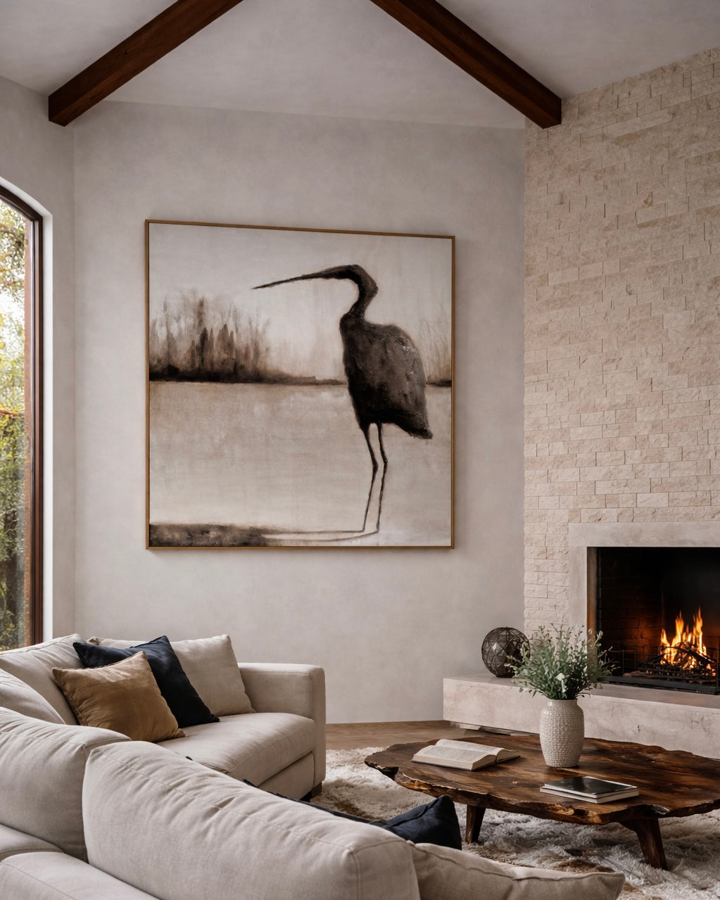 Modern living room with a large abstract painting of a bird, a fireplace, and a comfortable sofa.
