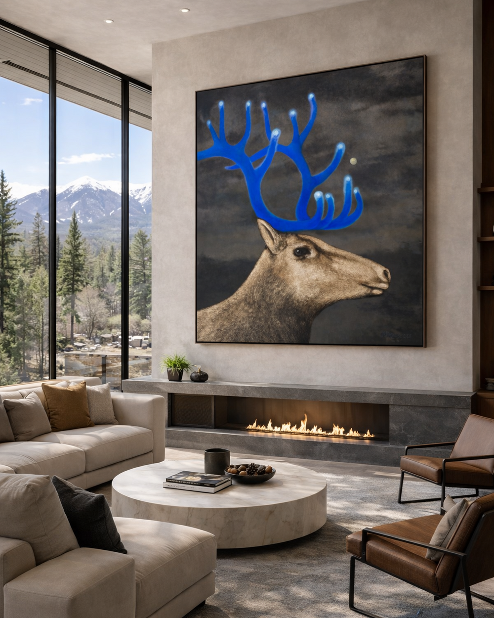 Modern living room with a large deer painting above a fireplace, featuring mountains and trees outside.