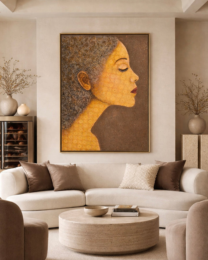 Living room with a large abstract painting of a woman's face above a beige sofa.