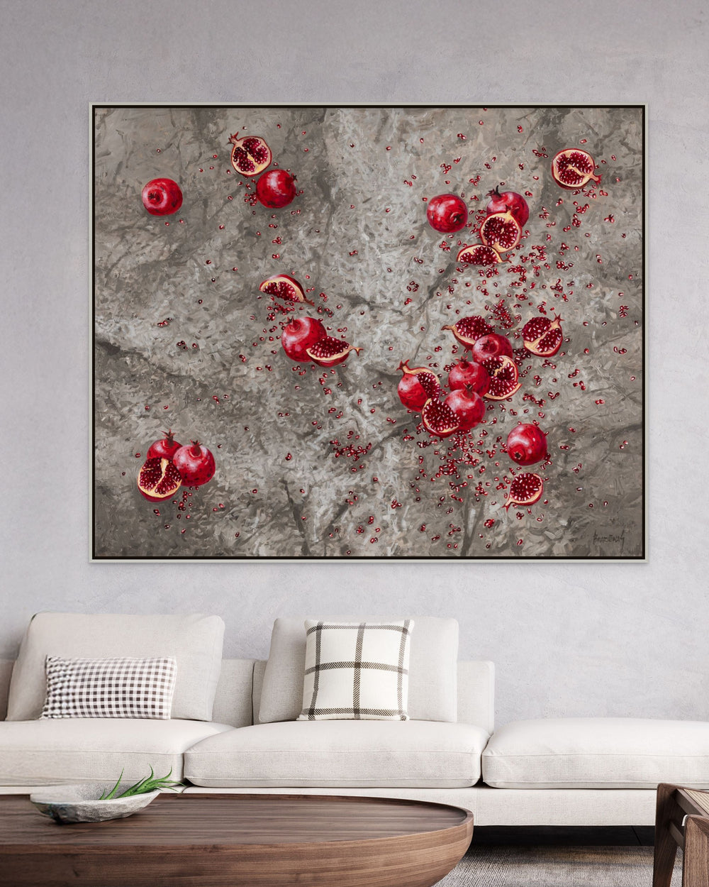 Framed pomegranate print canvas artwork with red fruit and seeds on gray wall