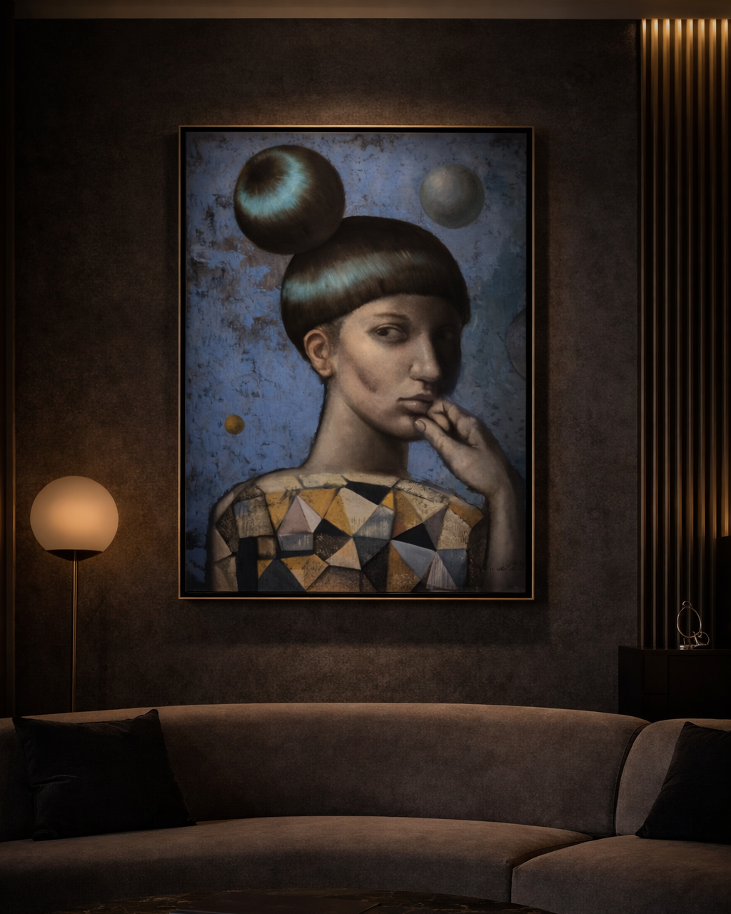 Framed artwork of a woman with geometric patterns on a wall above a sofa.
