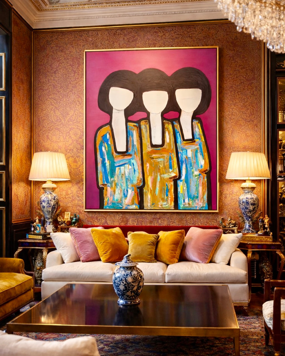 Living room with a large abstract painting above a sofa, two lamps on either side, and a decorative table in the foreground.