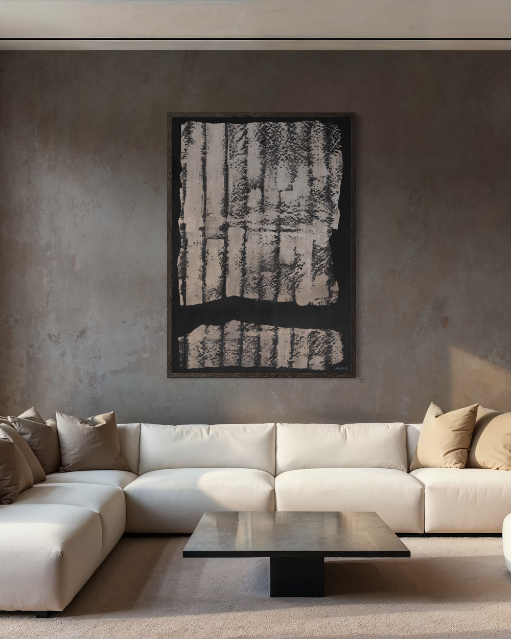 Modern living room with a white sectional sofa, coffee table, and abstract wall art.