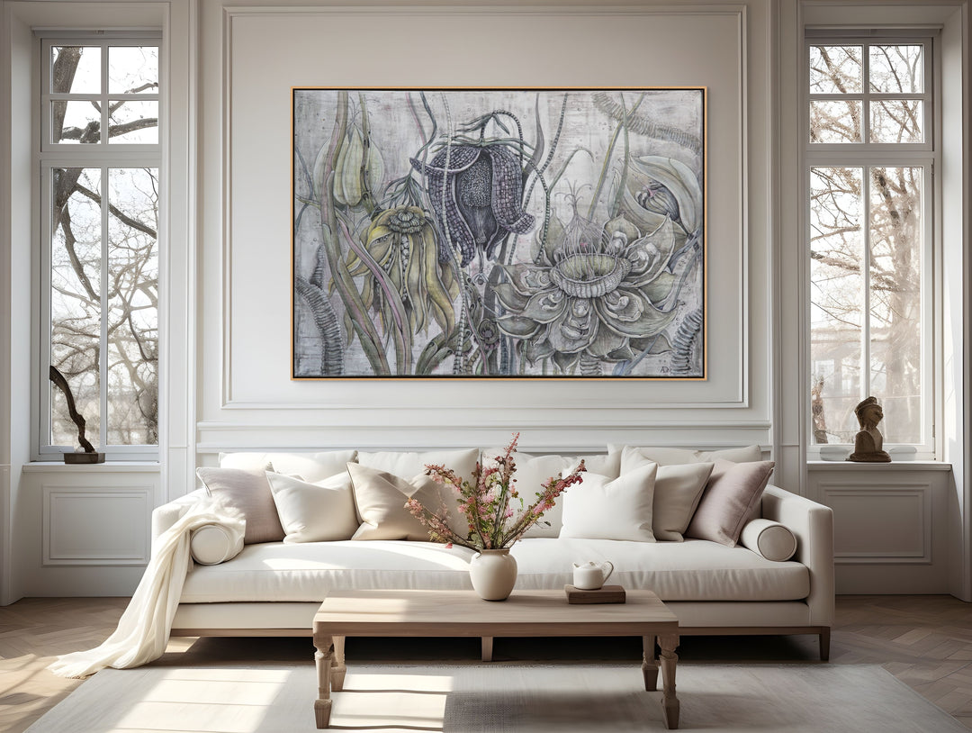 Living room with a sofa, coffee table, and decorative wall art.