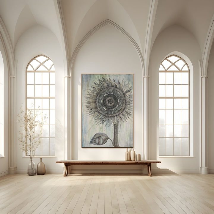 Large sunflower painting in a room with high ceilings and large windows